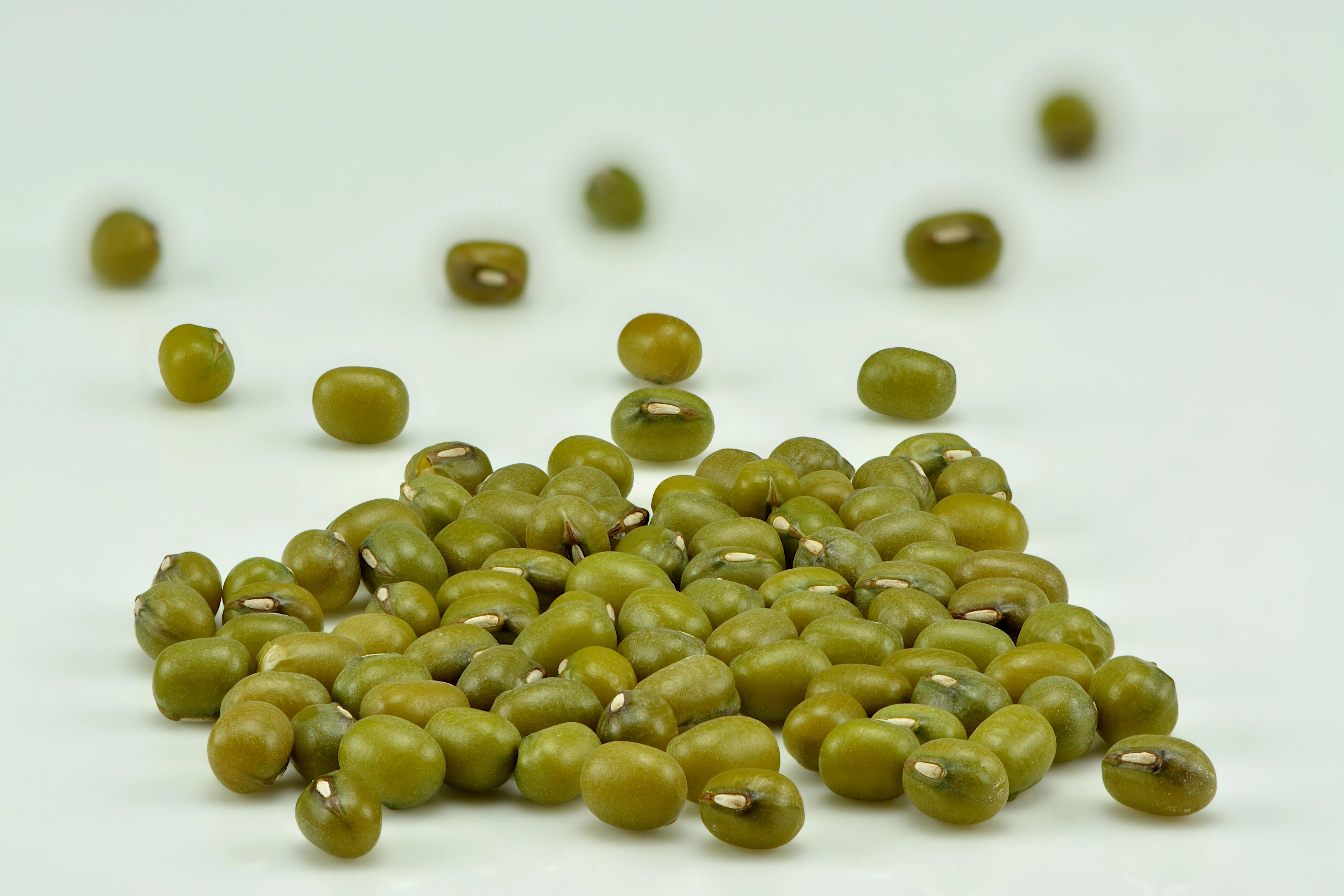 Some whole, unhulled mung beans